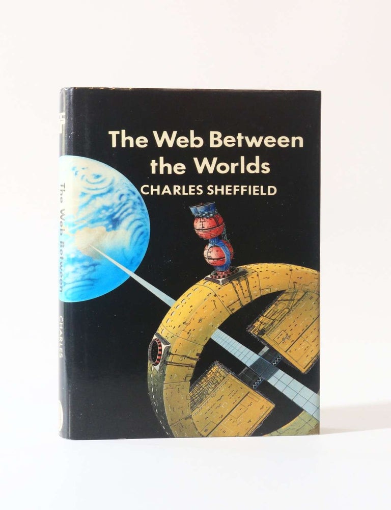 Item #12356 The Web Between the Worlds. Charles Sheffield.